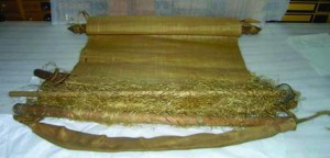 Backstrap loom with woven textile