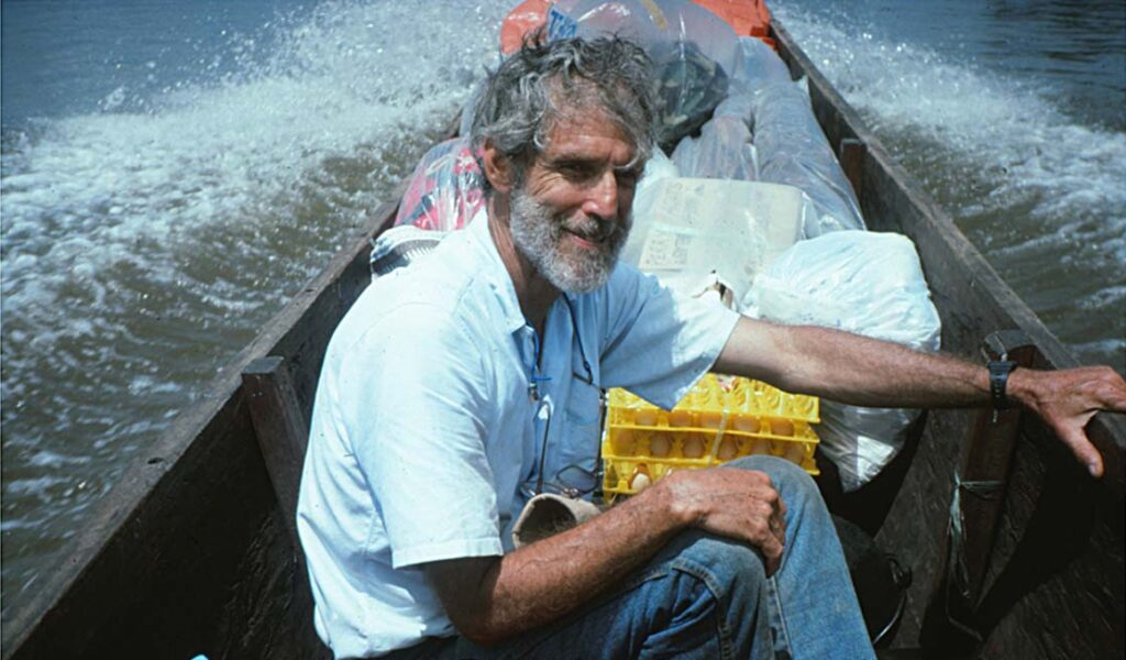 Ron in our big dugout motor canoe on the Sepik River
