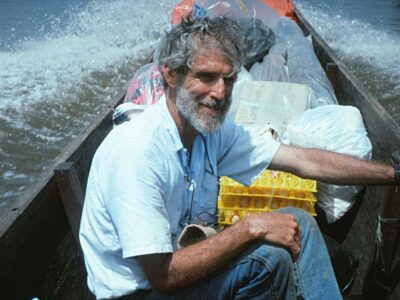 Ron in our big dugout motor canoe on the Sepik River